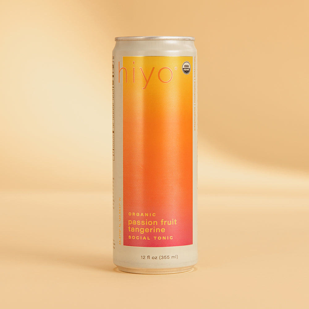 Tall aluminum can with gradient label transitioning from yellow at top to orange and red at bottom, labeled "hiyo" and "passi