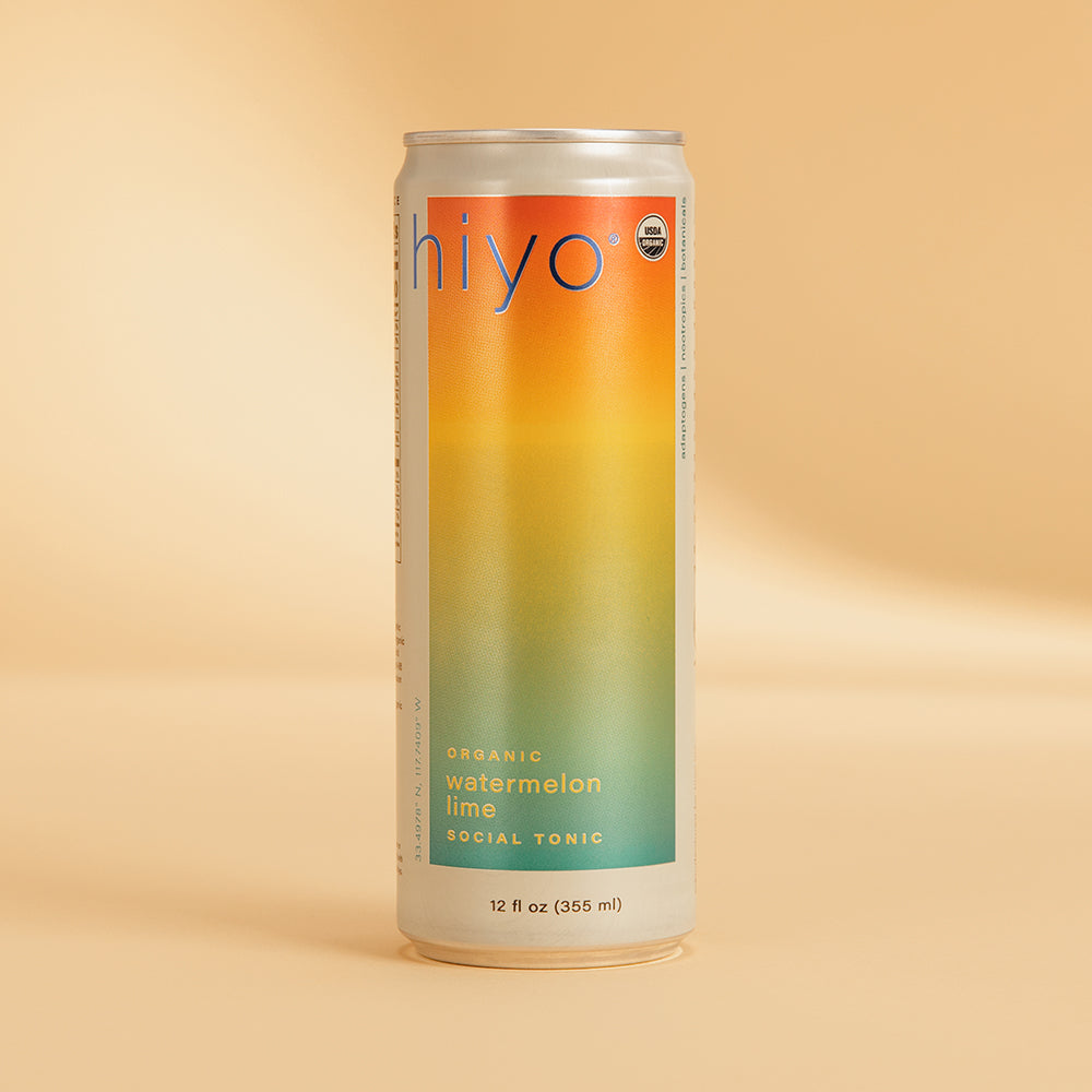 Tall aluminum can with gradient label transitioning from orange to yellow to green, labeled "hiyo watermelon lime social toni
