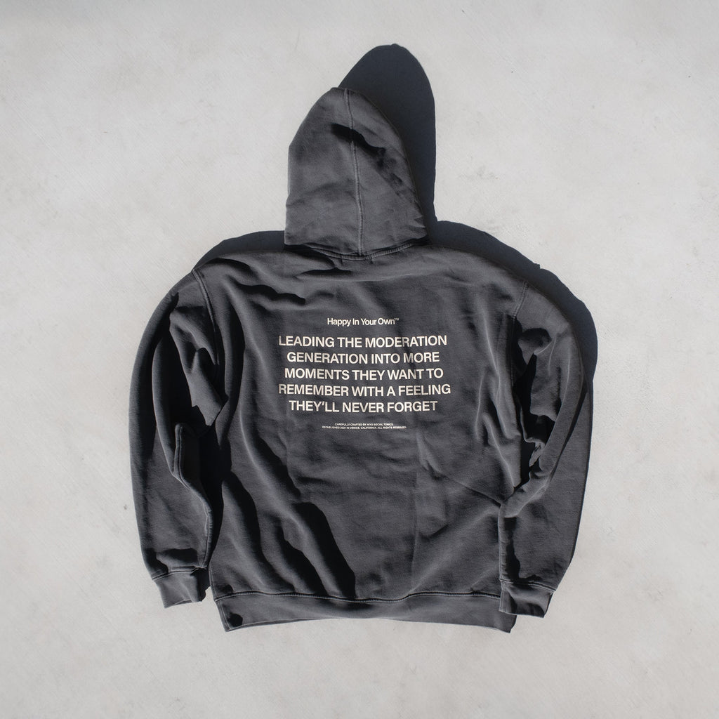 Charcoal gray zip-up hoodie with white text printed on the back and hood.