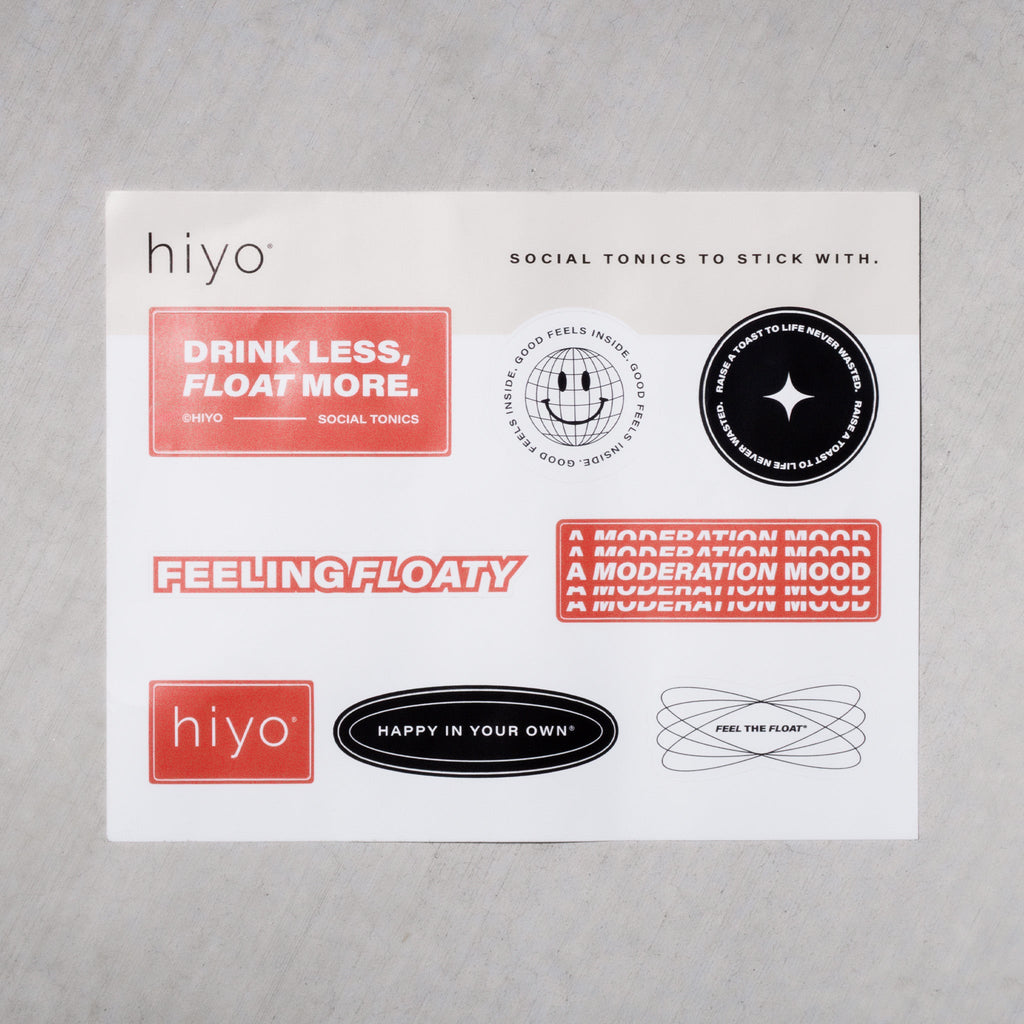 White sticker sheet featuring nine red and black Hiyo brand stickers with text phrases about moderation and wellness.