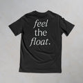 a charcoal t-shirt with 'feel the float' printed in white across the back.