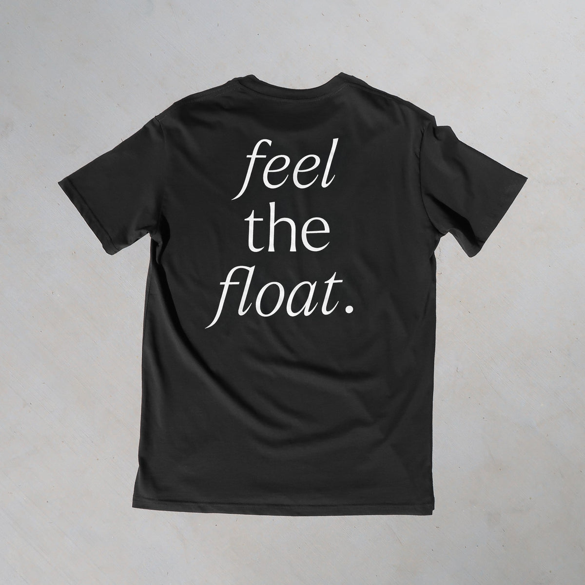 a charcoal t-shirt with 'feel the float' printed in white across the back.