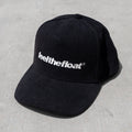 Black trucker hat with white "feel the float" text embroidered on the front.