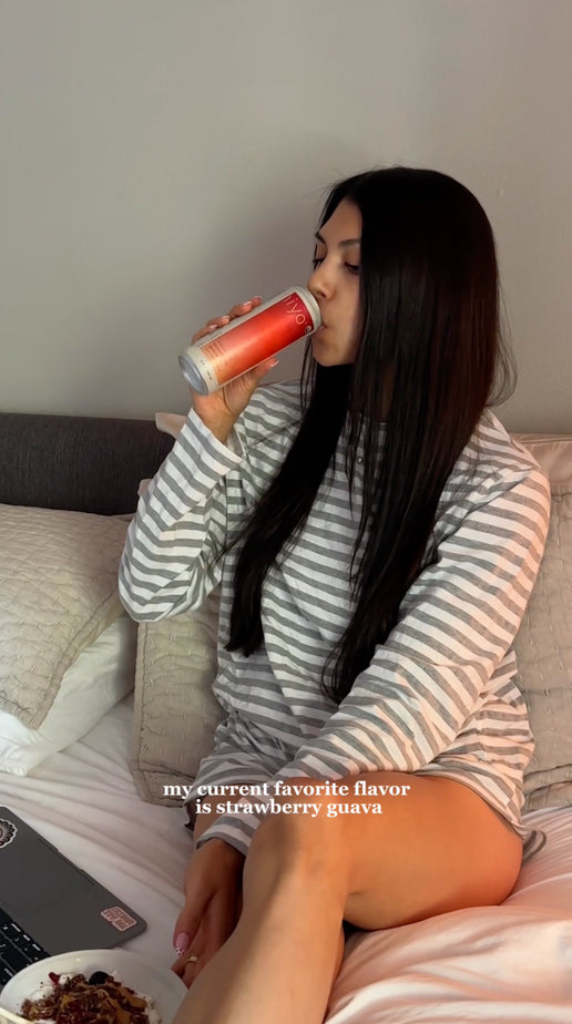 a woman shares her morning routine at home while enjoying a can of hiyo social tonic. the video shows her journaling in bed, taking a walk, preparing breakfast, and relaxing with the drink as on-screen text explains why she includes it in her daily routine.